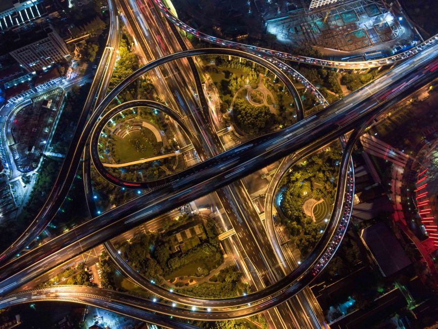 Aerial view of a city road network at dusk