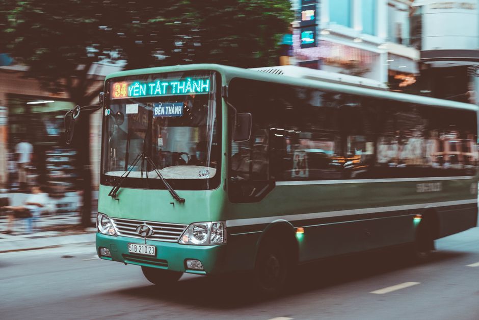 A city bus at a stop in traffic